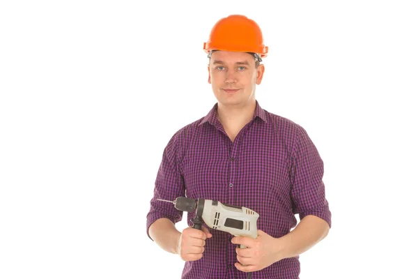 Construtor em hardhat com broca nas mãos — Fotografia de Stock