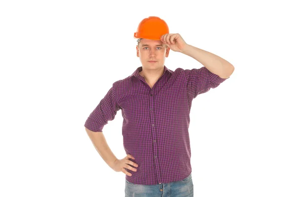 Bauarbeiter mit Helm blickt in die Kamera — Stockfoto