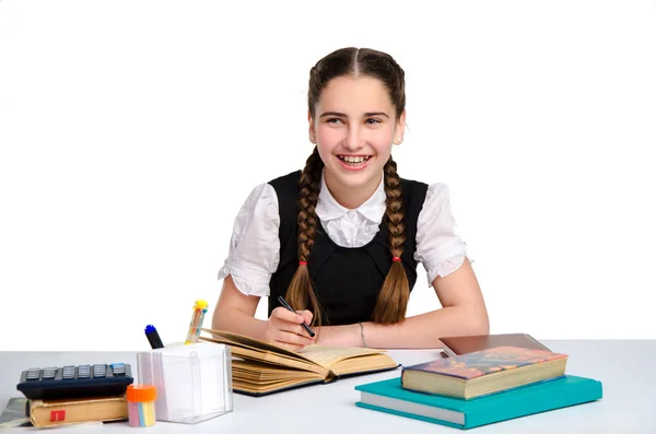 Junges glückliches Schulmädchen in Uniform — Stockfoto