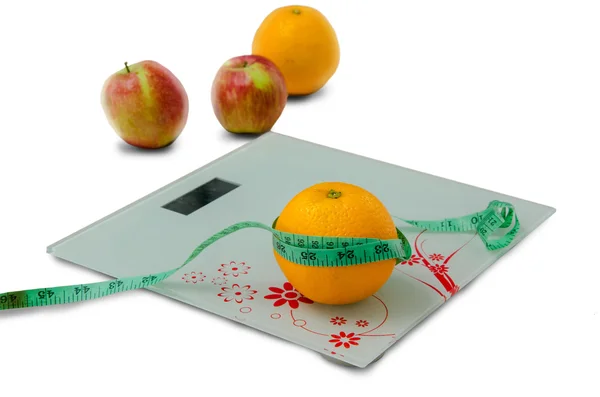Orange in a measuring tape — Stock Photo, Image