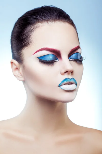 Beautiful brunette with pretty make up in studio — Stock Photo, Image