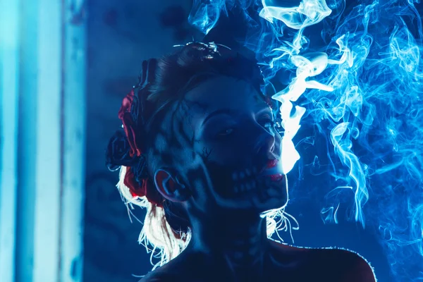 Face art of skull on woman face with smoke — Stock Photo, Image