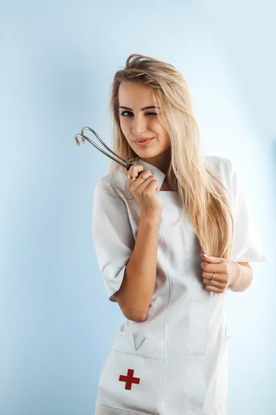 Nurse with stethoscope winks at the camera — Stock Photo, Image