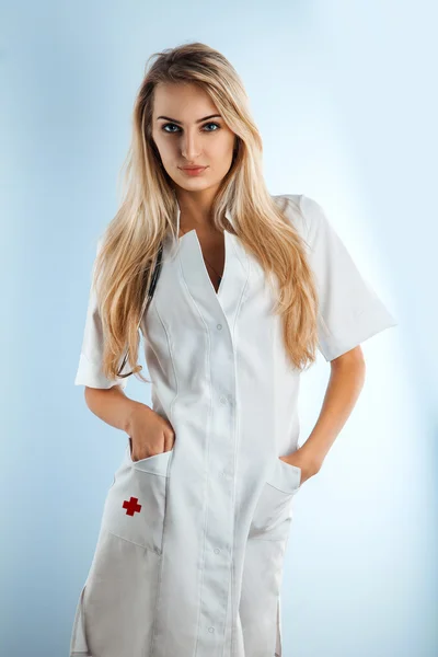 Cute blonde nurse in medical gown — Stock Photo, Image