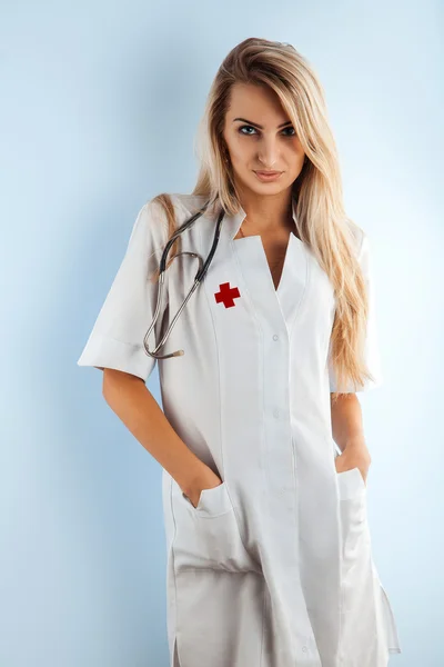 Blonde hair nurse in medical gown with stethoscope — Stock Photo, Image