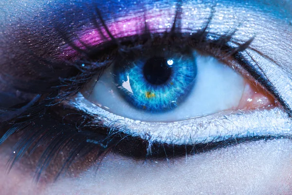 Close up photo of woman eye with multicolor make up. looking at — Stock Photo, Image