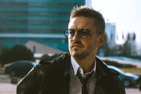 HIgh society male in glasses looking away on the street — Stock Photo, Image