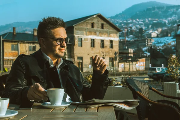 Horizontal portrait of business man with cup of coffee and newsp — Stock Photo, Image