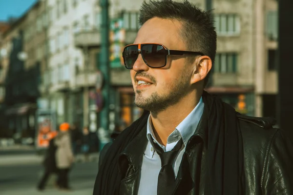 Portrait of beautiful adult male in sunglasses and tie looking a — Stock Photo, Image