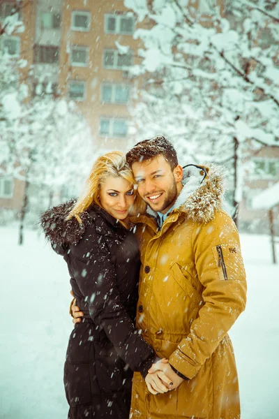 Vertical photo of betrothed couple in love looking at camera and — Stock Photo, Image