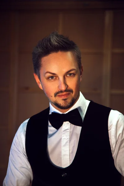 Portrait of fashionable man in white shirt and bow-tie — Stock Photo, Image