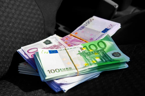 Macro photo of a pack of money EUR on a car seat — Stock Photo, Image