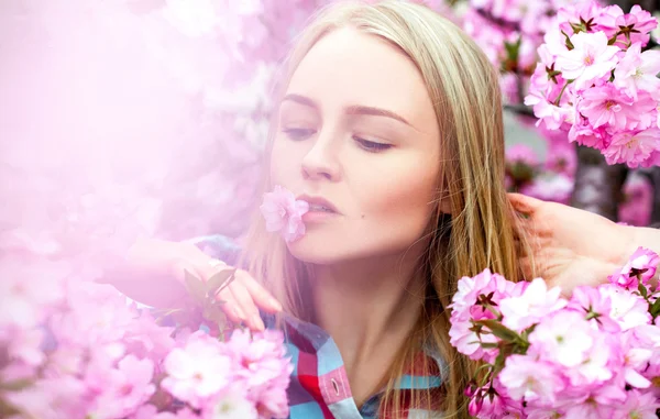 Bright charming woman with flower in mouth — Stock Photo, Image