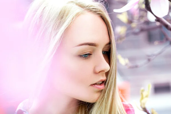 Thoughtful young blonde with blue eyes looking away — Stock Photo, Image