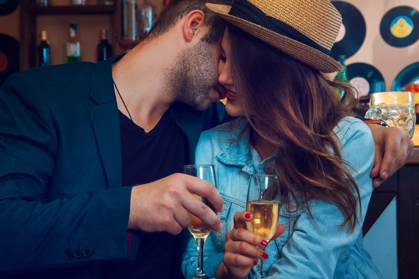 Elegant male kiss girlfriend in cheeks — Stock Photo, Image