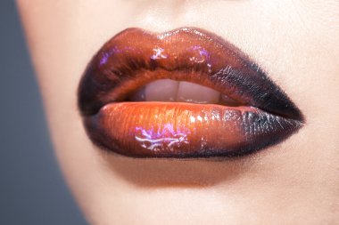 Woman lips with lipstick in studio