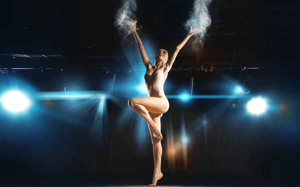 Slim fun caucasian ballerina posing on stage — 图库照片