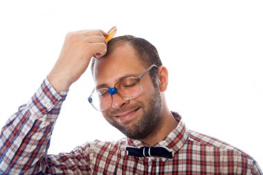 unshaven man nerd combing hair