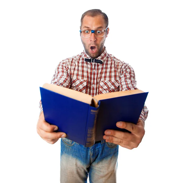 Surprised geek reading book on white background — ストック写真