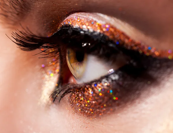 Macro photo of green woman eye with make up — Stockfoto