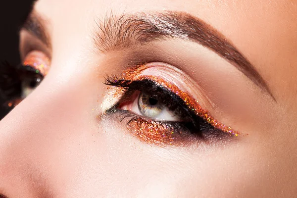Close up photo of woman eyes with professional make up — ストック写真