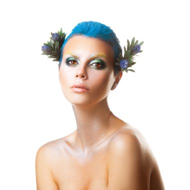 Serious young girl with short blue hairstyle and multicolor make