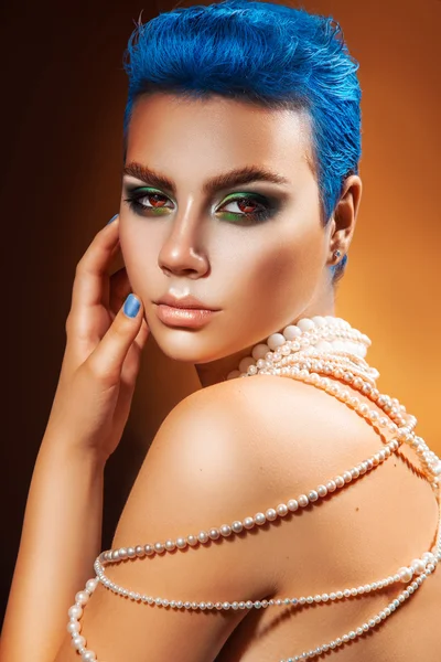 Adorable young woman with blue hair and nails looking at camera — Stock Photo, Image