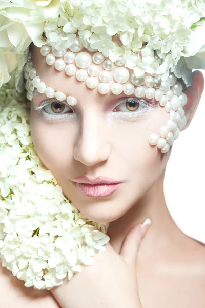 Beautiful young woman looking at camera in studio. Tender makeup Royalty Free Stock Images