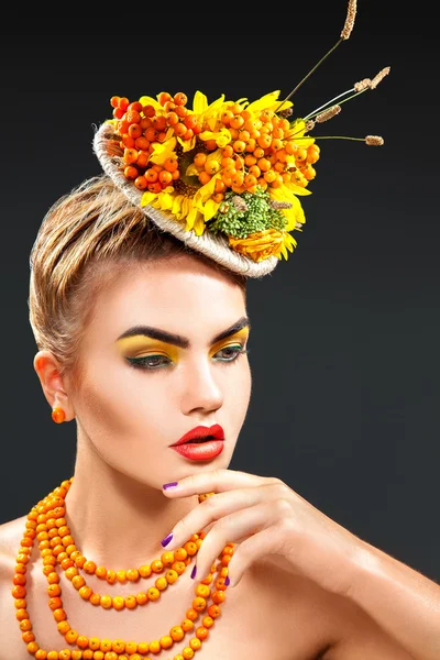 Vertical studio portrait of fashion model with rowan bouquet — Stock Photo, Image