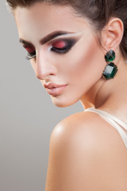 Sexy young girl with healthy skin and professional makeup with c
