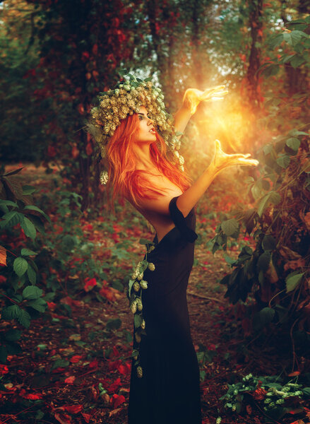 Fantasy photo of young redhair lady wizard outdoors
