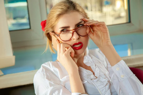 Close up portrait of sexy blonde secretary talking phone — Stock Photo, Image