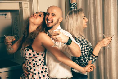 Portrait of glamour friends dancing at house party