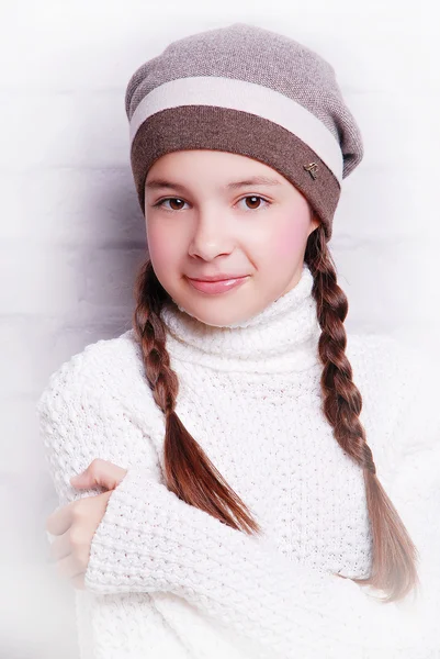 Adorable smiling girl in warm hat — Stock Photo, Image