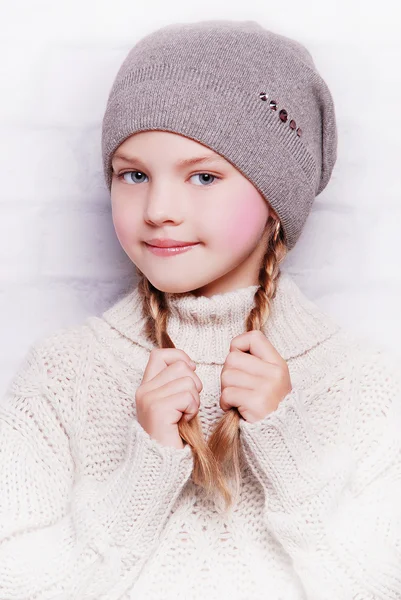 Adorable smiling girl in warm hat — Stock Photo, Image