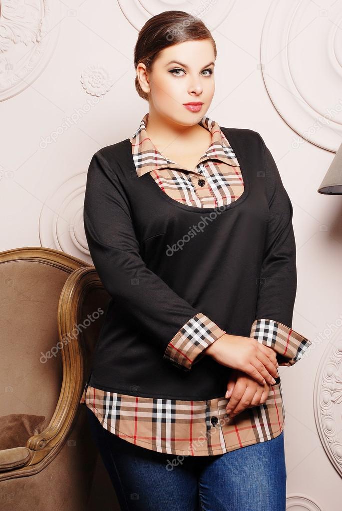 Plus size woman in trendy clothes