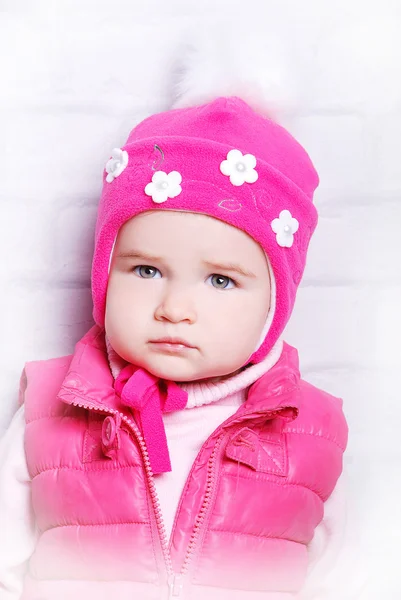 Child girl in warm knitted hat — Stock Photo, Image