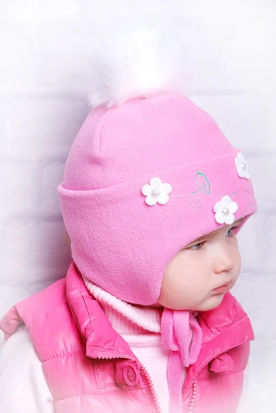 Child girl in warm knitted hat — Stock Photo, Image