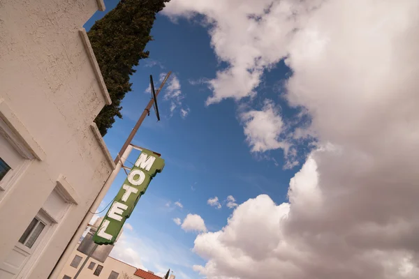 Neon Motel Sign Clear Blue Sky White Billowing Clouds — Stok Foto