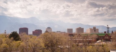Colorado Springs Downtown City Skyline Dramatic Clouds Storm Approaching clipart
