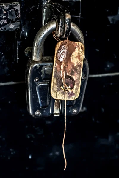 Padlock on door seal — Stock Photo, Image