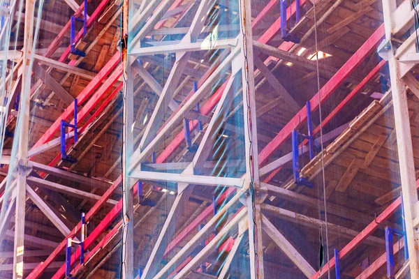 Scaffolding covered by mesh — Stock Photo, Image