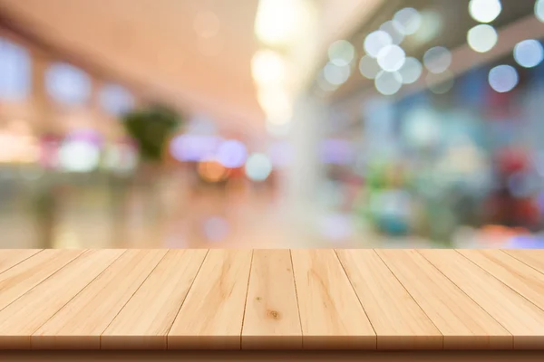 Alışveriş Merkezi bokeh ve ahşap zemin ile arka plan bulanık — Stok fotoğraf
