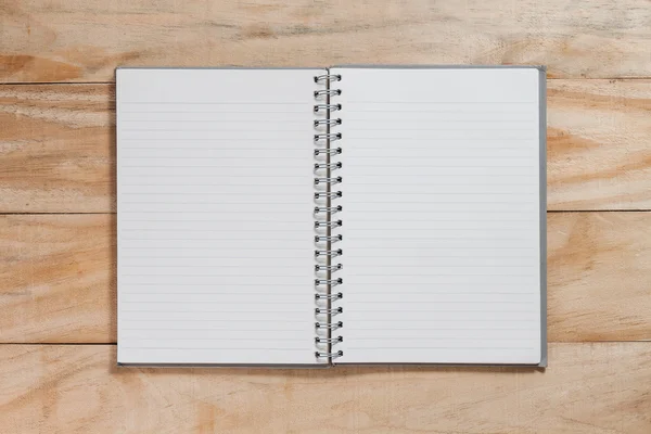 Notebook op houten tafel — Stockfoto