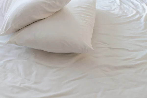 White pillows on a bed — Stock Photo, Image