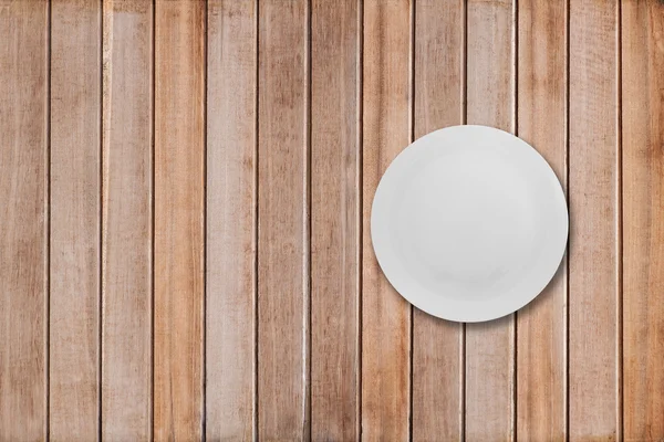 White dishes on a wooden table — Stock Photo, Image