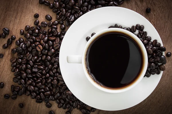 Tasse à café avec haricots — Photo