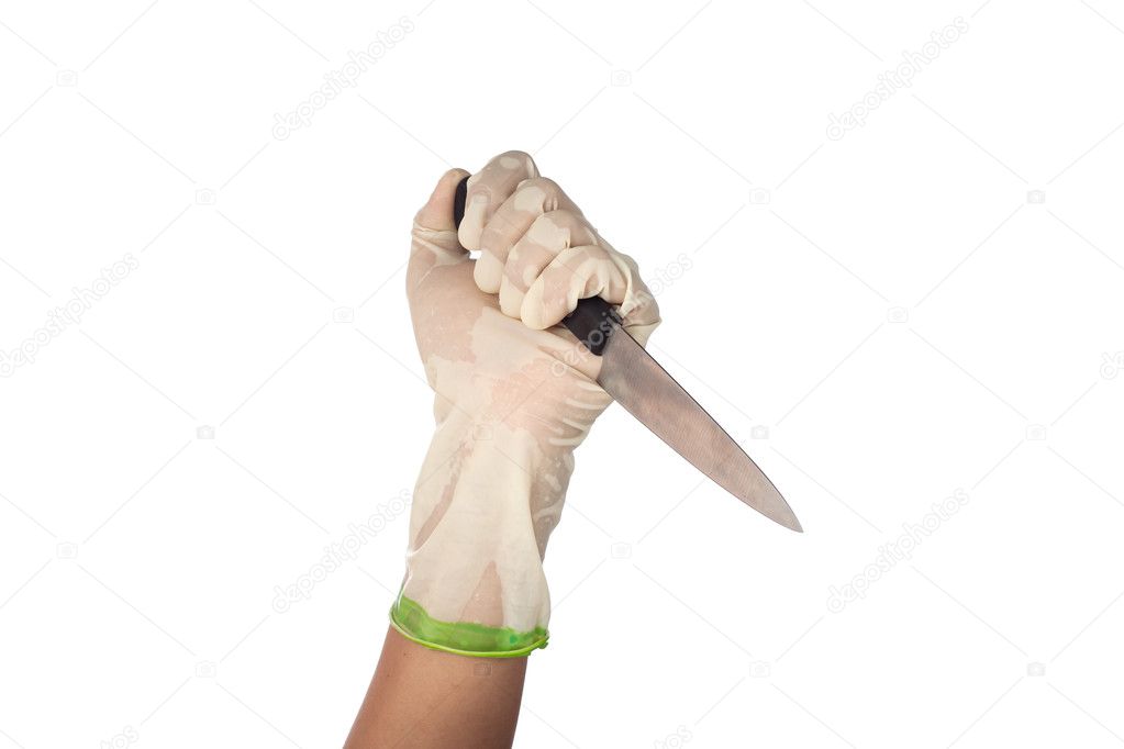 a white gloved hand holding a knife