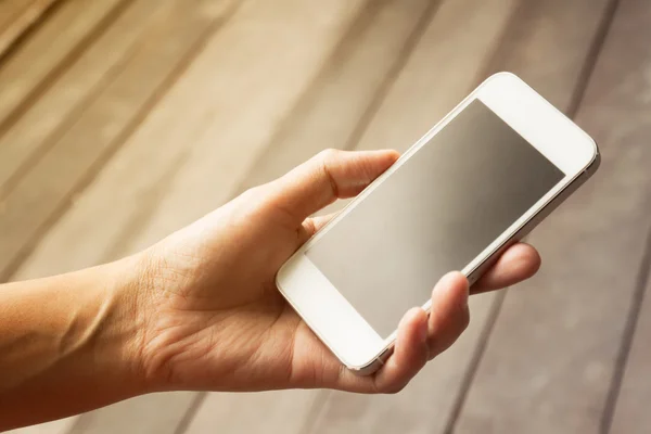 Woman using mobile smart phone,in vintage style — Stock Photo, Image