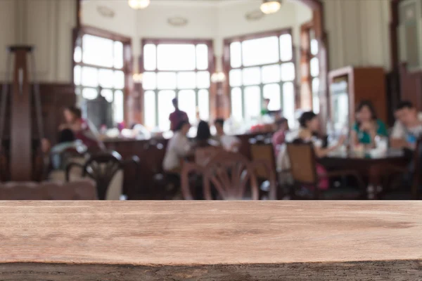 Empty wood table and blurred coffee shop  background. — Stock Photo, Image